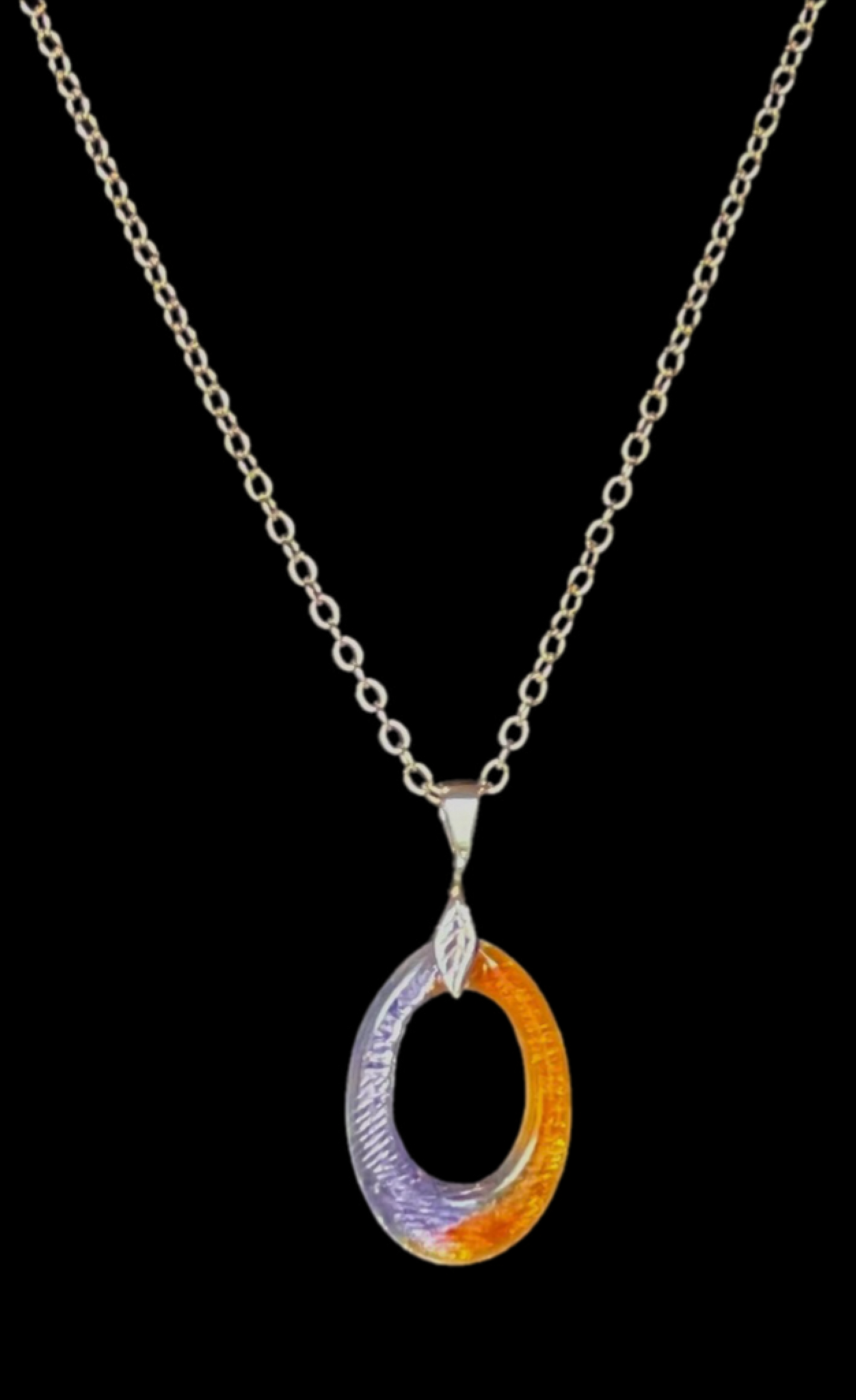 Necklace with a multicolored pendant on a black background