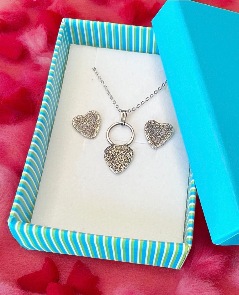 gift box in blue containing jewelry set
