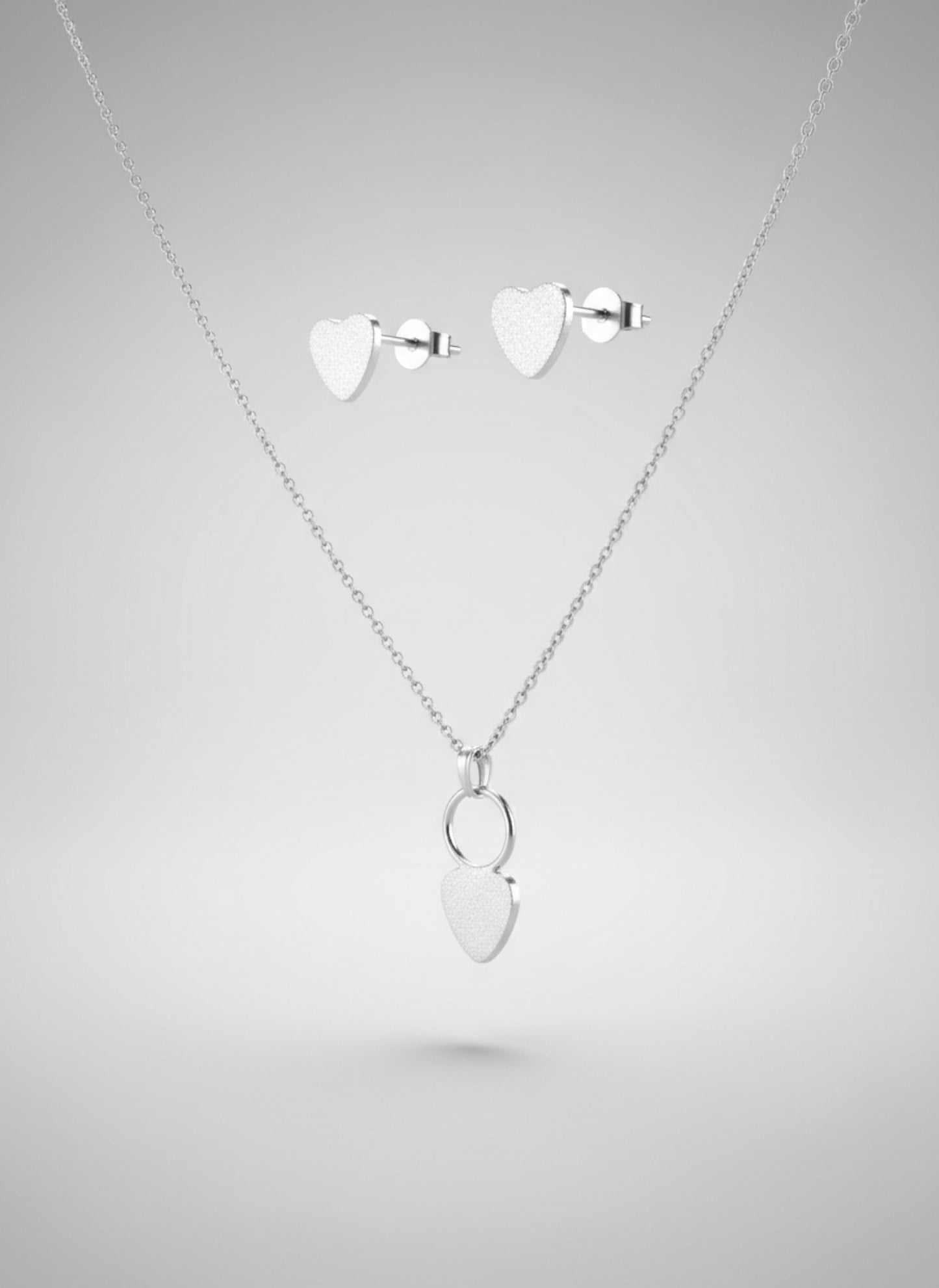 silver set earrings and necklace