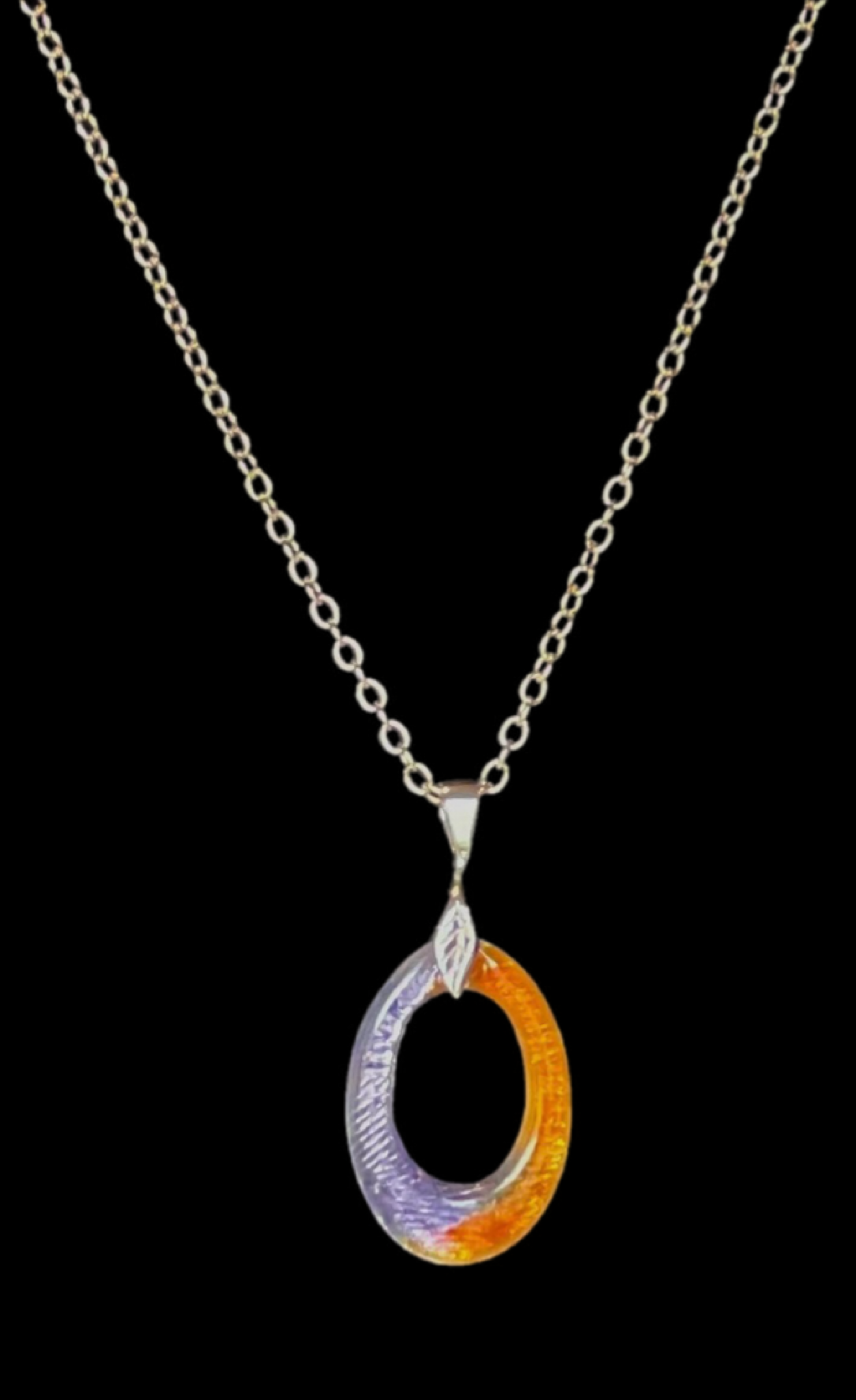 Necklace with a multicolored pendant on a black background