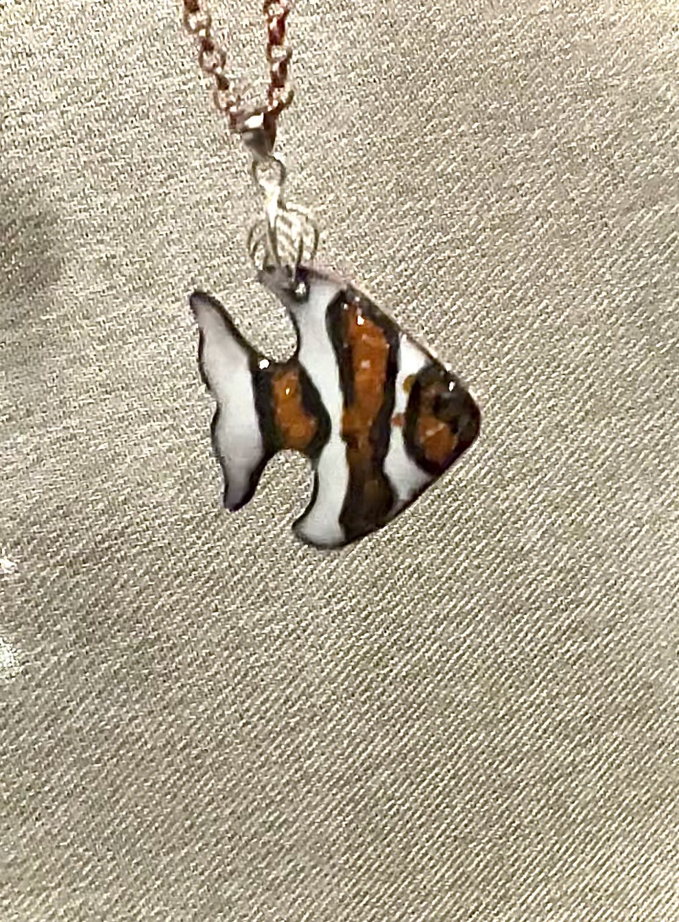Video of clown fish pendant, orange white and black fish