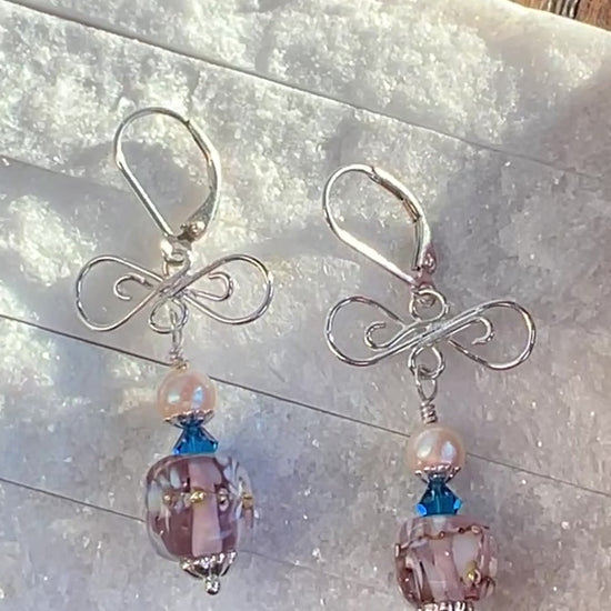 VIDEO OF EARRINGS WITH PINK BEAD, BLUE CRYSTAL, PINK PEARL AND SILVER LACE.