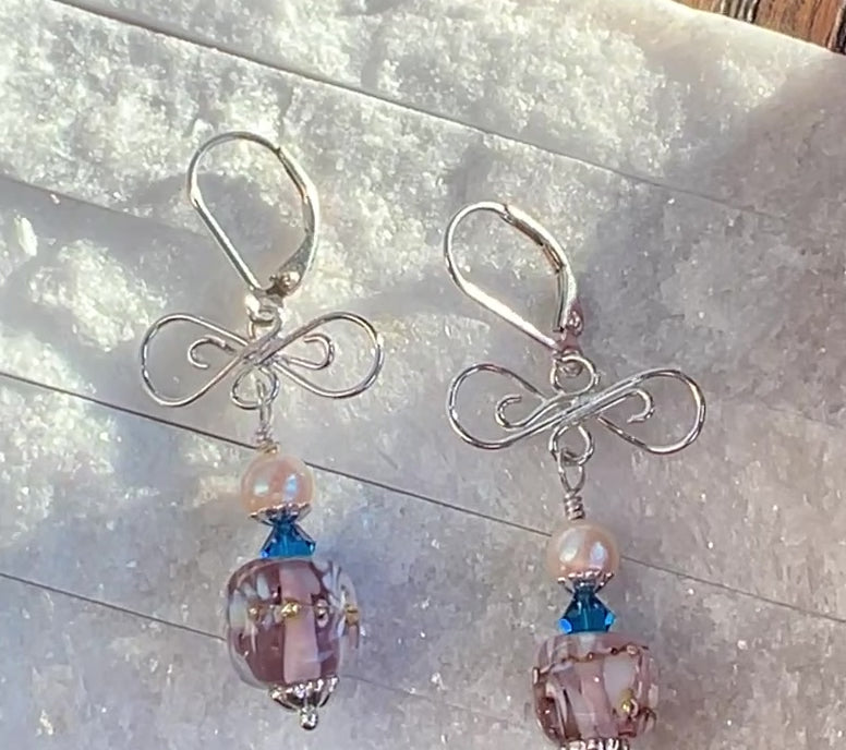 VIDEO OF EARRINGS WITH PINK BEAD, BLUE CRYSTAL, PINK PEARL AND SILVER LACE.
